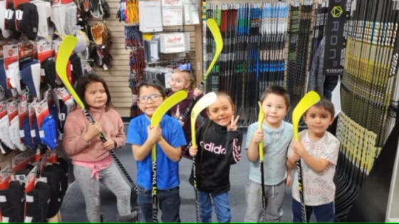 George Gordon gifts community children with brand new hockey equipment